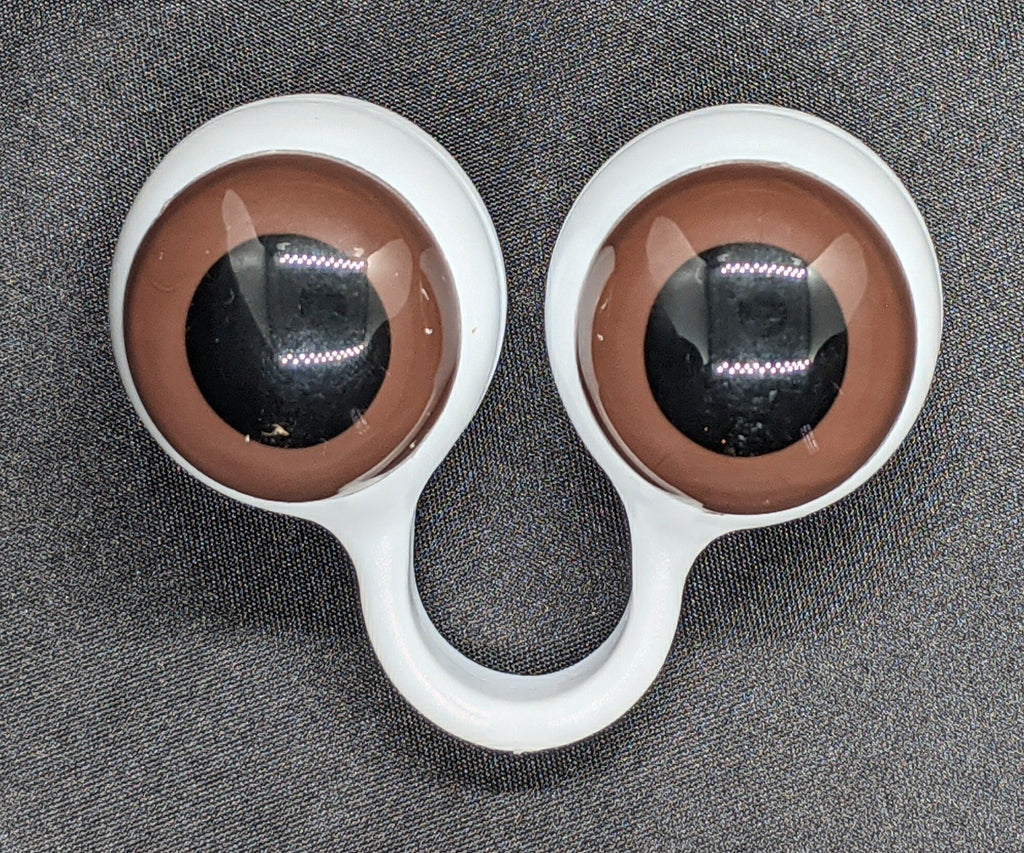 White pair of Peepers Puppets with Brown Eyes.