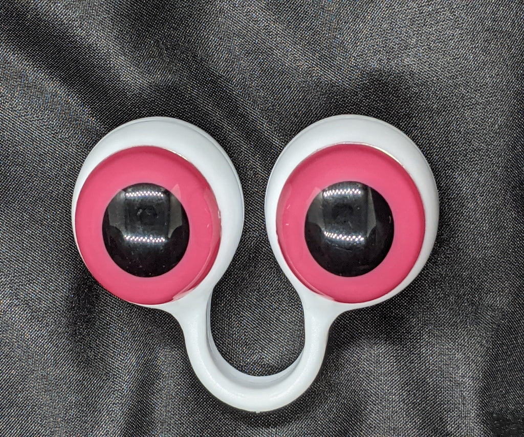 White pair of Peepers Puppets with Pink Eyes.